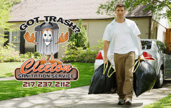 Cleeton Sanitation crew member hauling trash